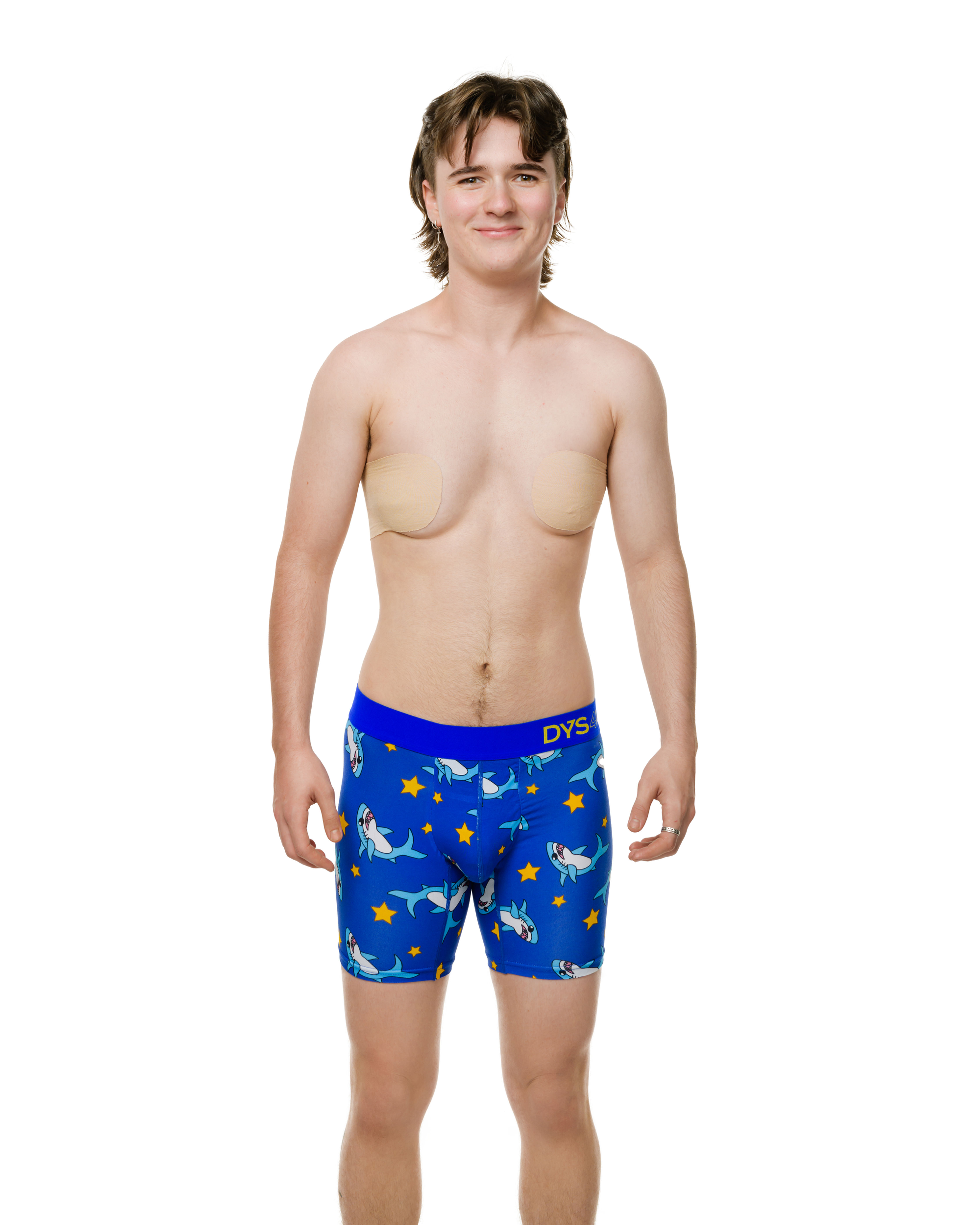 Front view of a transman wearing packing boxers with trans shark icon