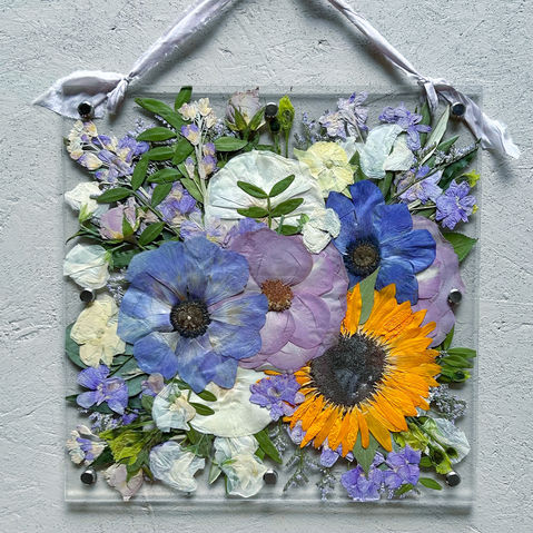 blue purple and yellow preserved wedding flowers in frame
