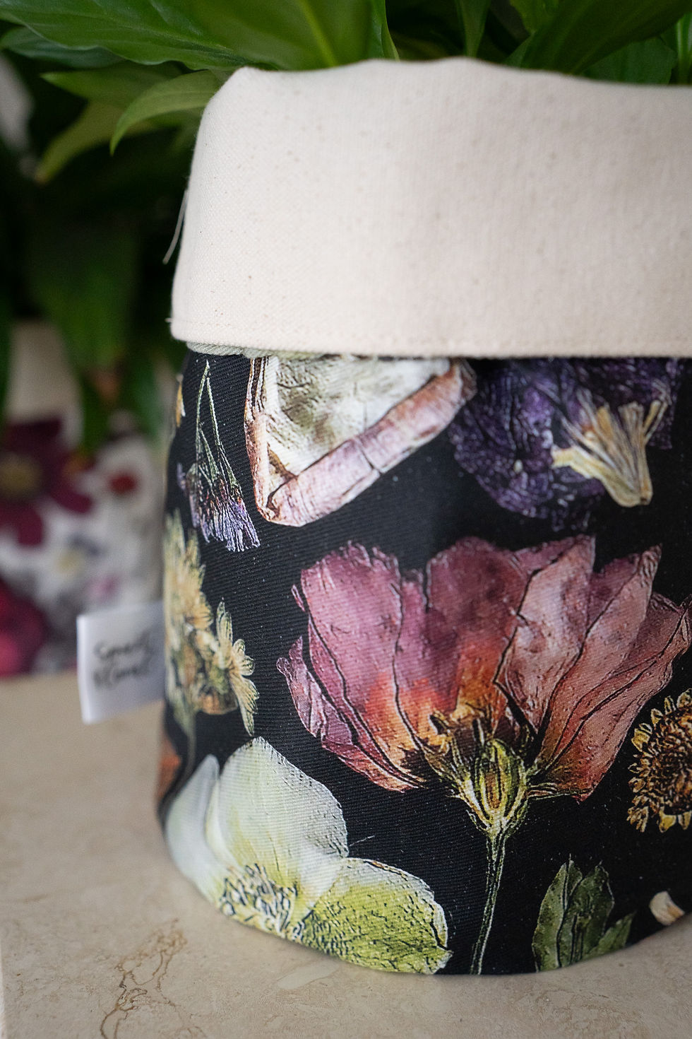 Thumbnail: close up of single black multicoloured plant pot bag