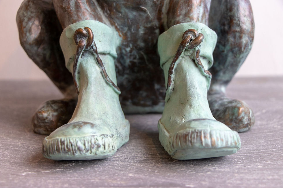 Thumbnail: Hondenweer XL III by Annemarie van der Kolk – A bronze sculpture of a dog with its flappy ears blowing in the wind, wearing rain boots, capturing a playful and endearing moment with detailed artistry