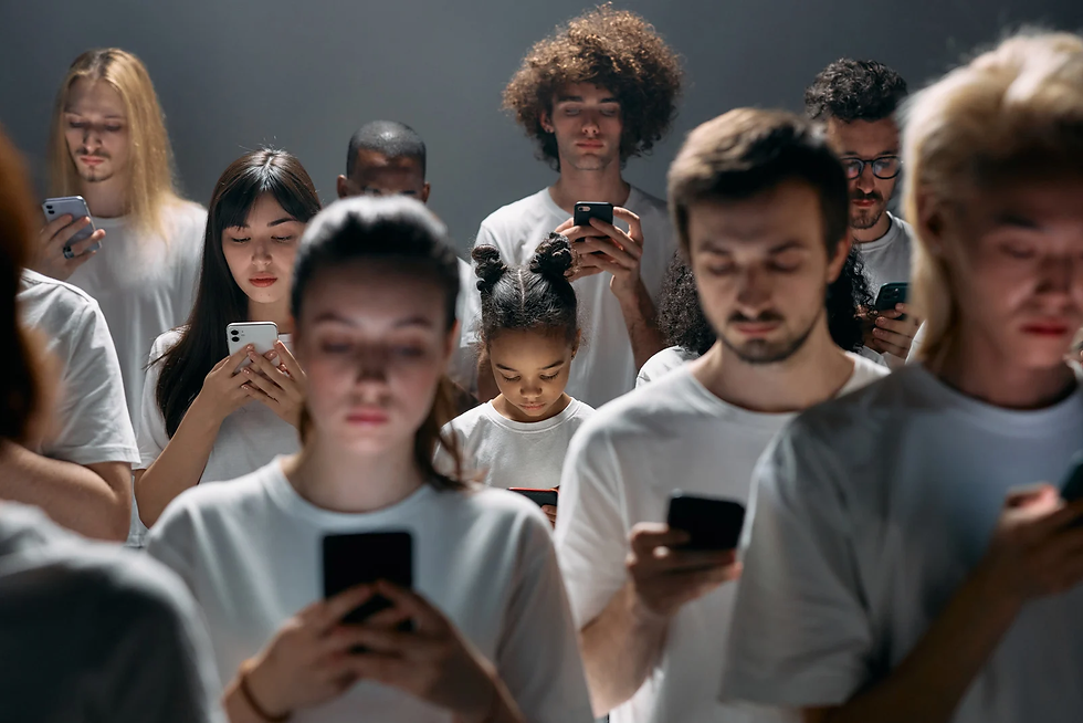 A group of diverse people staring at their phone