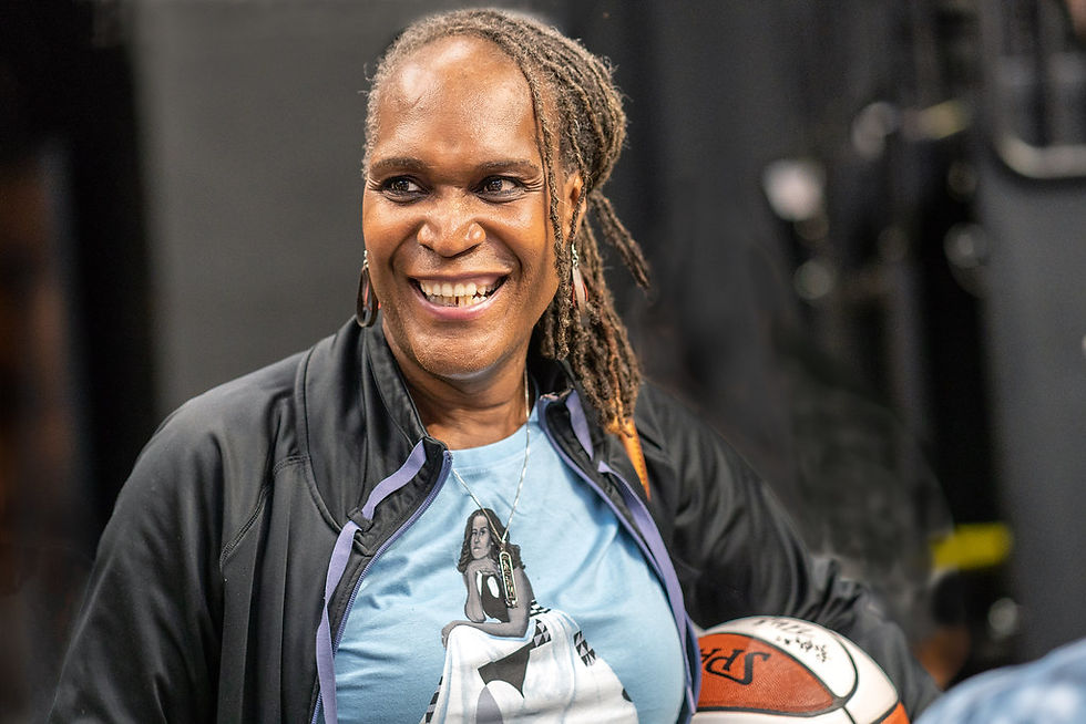 trans-identified man playing basketball