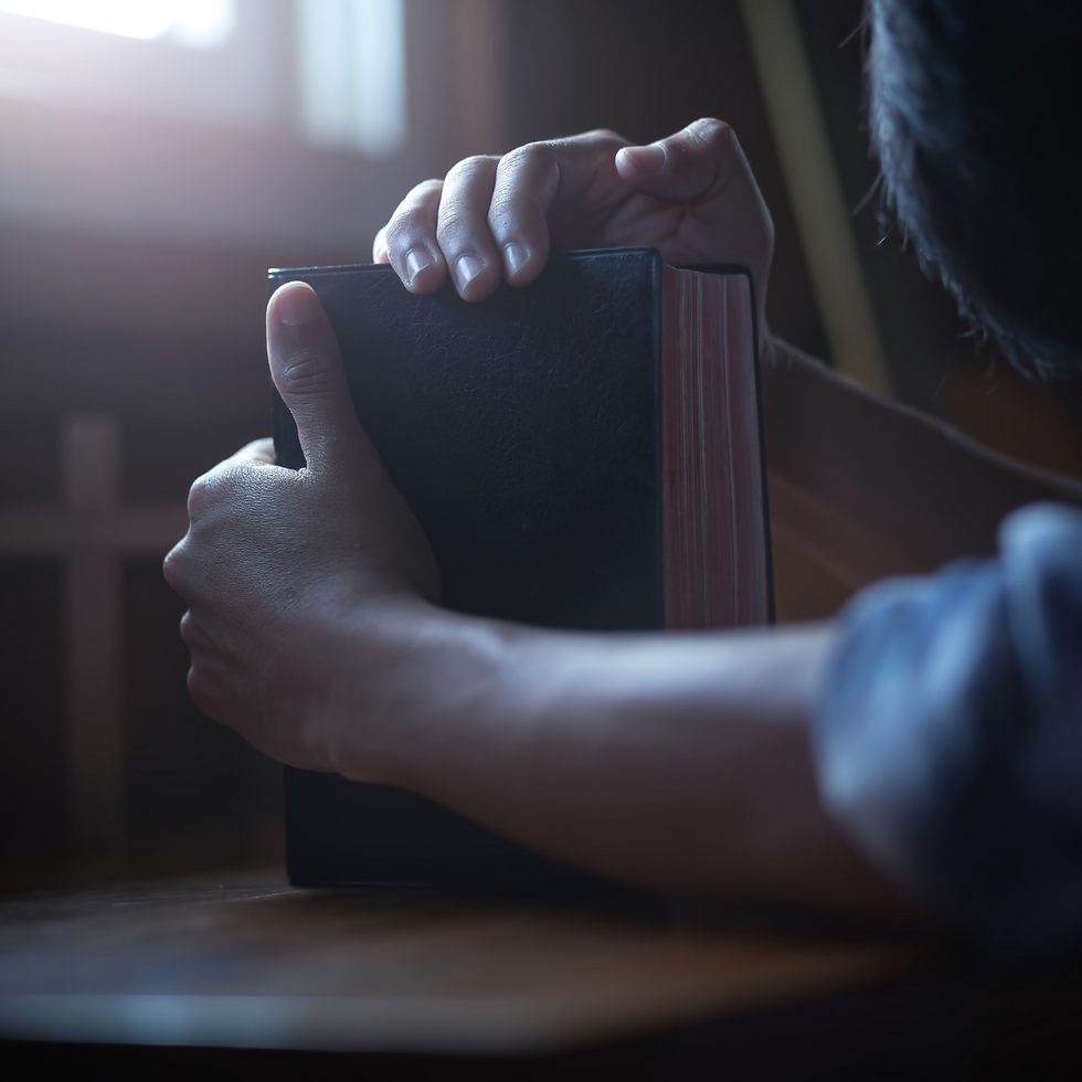 man with Bible repenting of sin and praying
