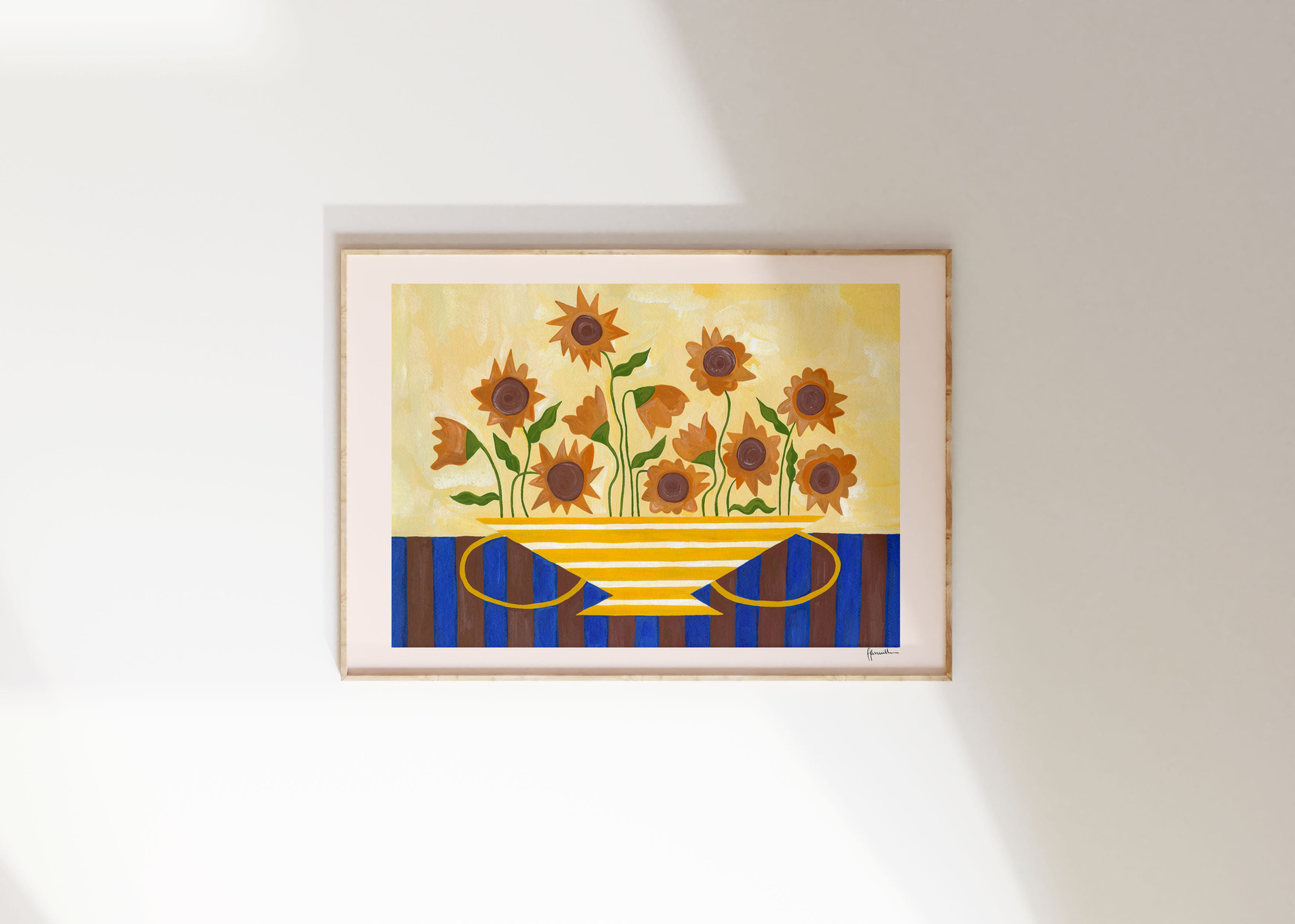 sunflowers in yellow striped vase