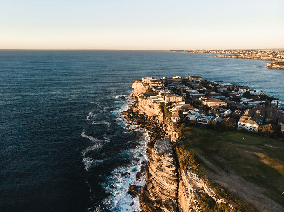 An image of coastline and housing