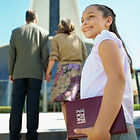 Person holding Bible going to Bible Study
