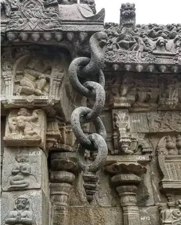 Intricately carved stone chain in a South Indian temple, showcasing remarkable craftsmanship, detailed stone sculpture, traditional temple architecture, and the artistic heritage of ancient Indian craftsmen.