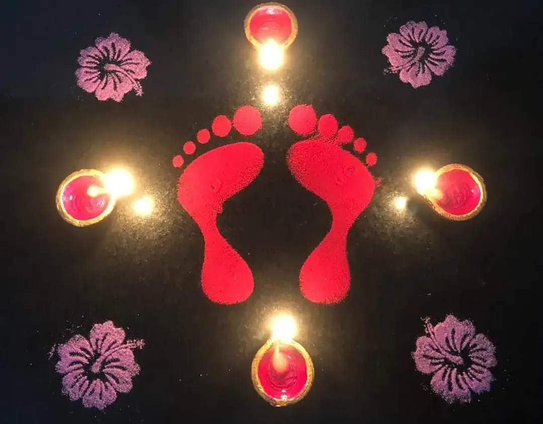 Krishna Jayanthi Kannan Kolam featuring tiny baby Krishna footprints drawn from the entrance to the prayer room, symbolizing Lord Krishna entering the home and bringing divine blessings.