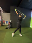 Golf swing warm up indoor facility
