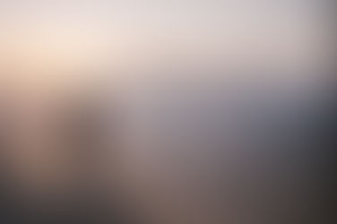 A man looking at the horizon during sunset