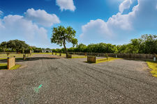 Spacious RV park sites, sunny day at River Banks RV Resort