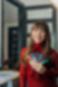 Smiling woman holding paint swatches