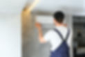 happy-male-technician-repairing-air-conditioner.jpg