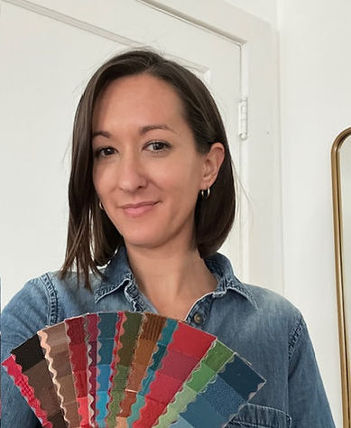 Woman holding colorful fabric swatches
