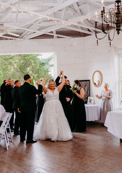 a bride and groom are announced into their wedding reception at historic Arcadia Farm