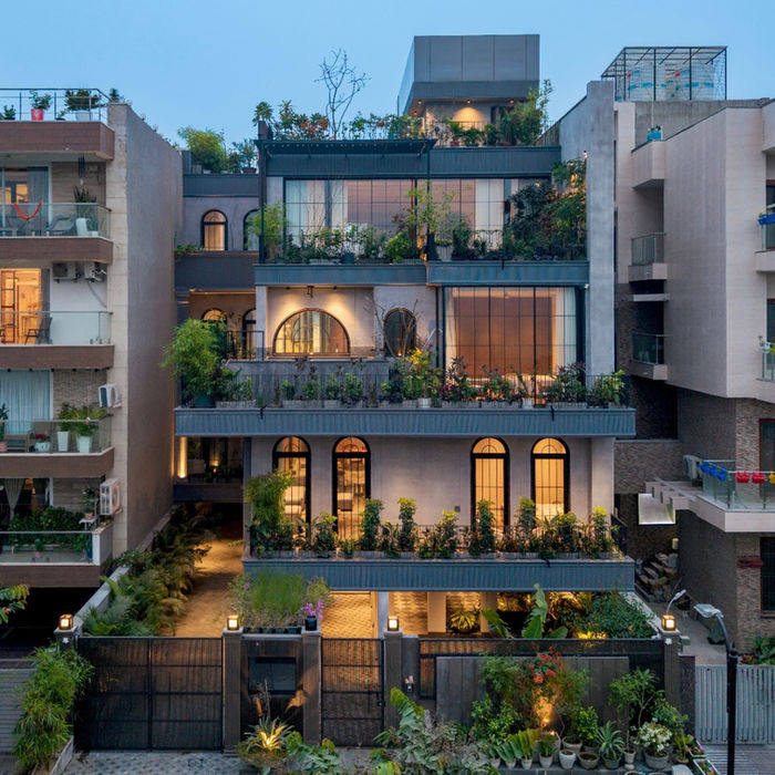 modern architectural facade with sharp geometry and warm lighting