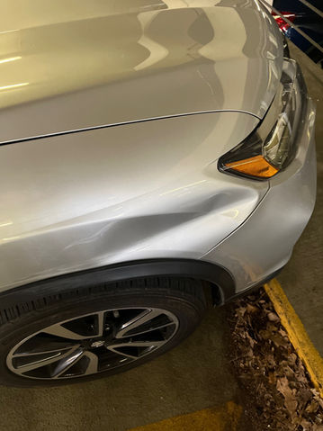 Large dent on front right fender