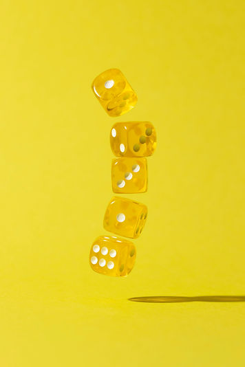 falling-yellow-dices-yellow-background.jpg