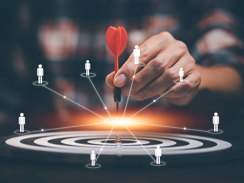 Businessman touch red arrow dart to the virtual target dartboard