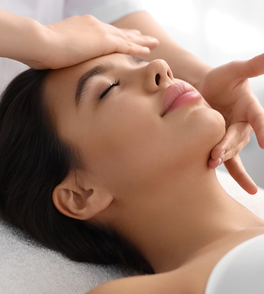 Young woman having facial massage in salon, closeup.jpg