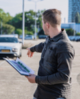 Driving instructor explaining to a stude