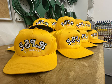 embroidered hats on a table