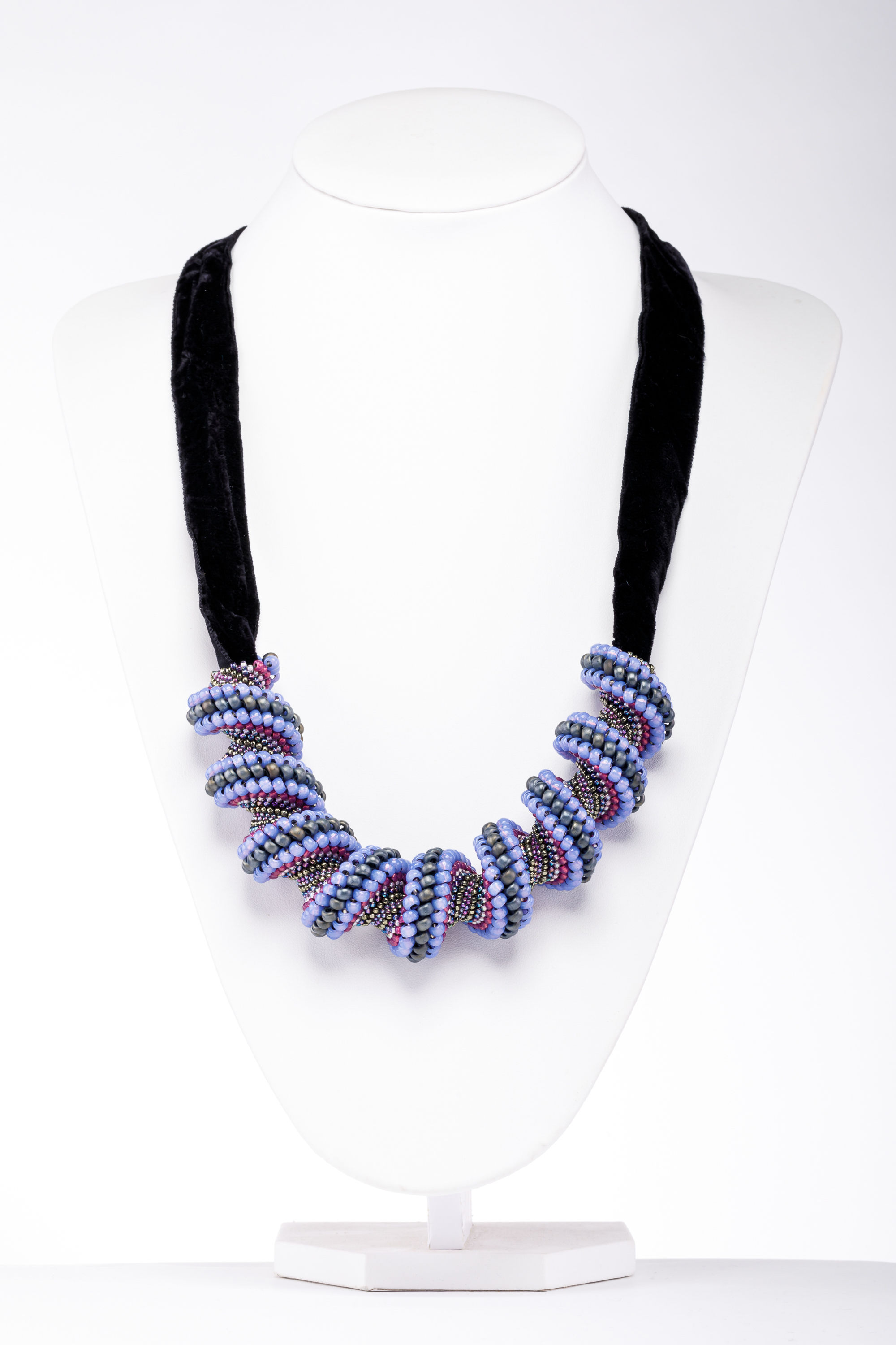 Hand stitched spiral necklace