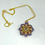 Thumbnail: Hand stitched crystal flower pendant