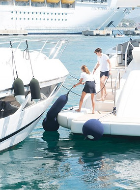 yacht-crew-handling-fenders-and-lines-for-superyacht-mooring-activity.jpg