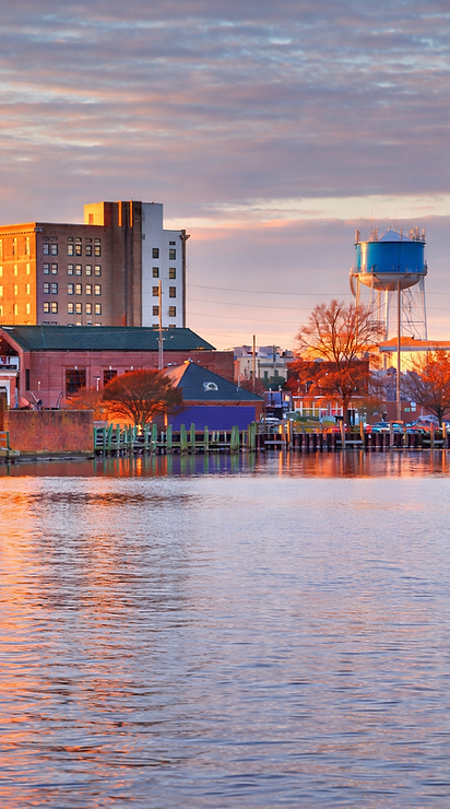 Sunset over the waterfront town (1).png