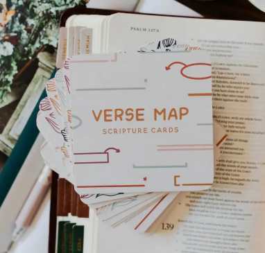Verse Map Scripture Cards fanned out and placed on an open Bible, showing decorative tabs and the book of Psalms.