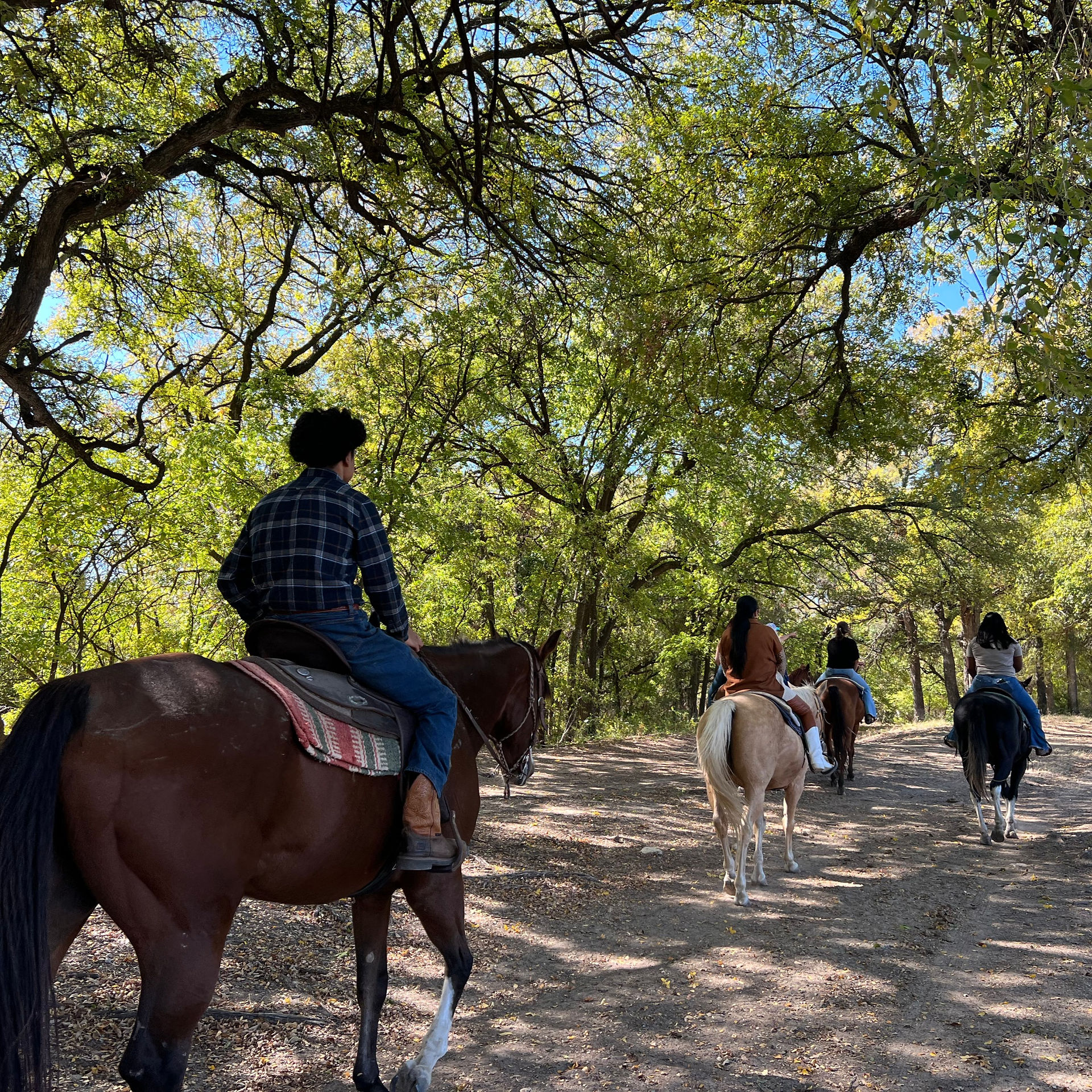 Thanksgiving family outing on a guided trail ride at Benbrook Stables in Fort Worth, Texas.