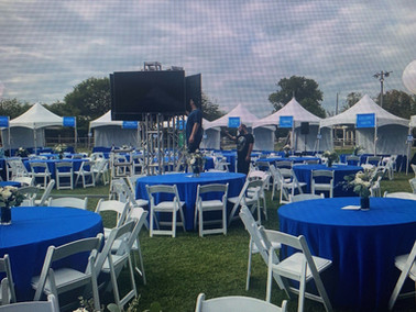Spacious corporate event venue in Fort Worth, Texas, featuring modern amenities, a versatile layout, and a stage for live music, perfect for conferences, meetings, and special events.