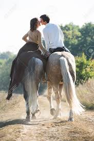 romantic couple on a date on horseback on Texas trail ride