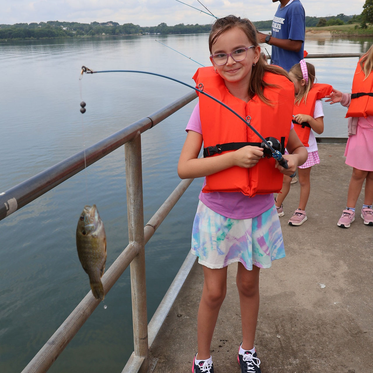 Benbrook Stables Spring Break and Summer Fish Camp Voted Best Camp in Fort Worth Texas Catching a fish at Benbrook Lake
