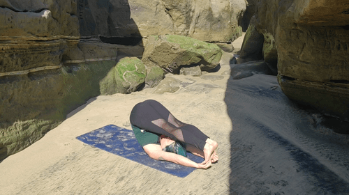 a women performing a yoga movement for hikers