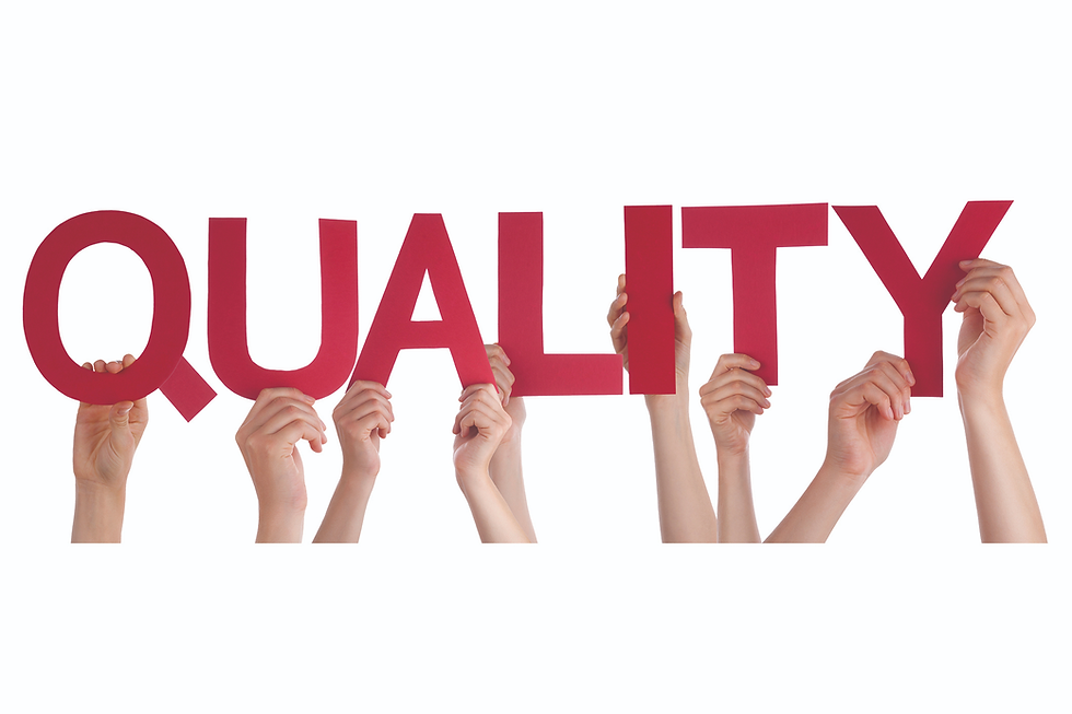 Hands hold up red letters spelling "QUALITY" against a white background. Bright and positive mood, emphasizing teamwork.