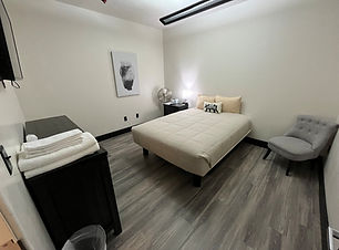 Budget Single Queen Room with a Smart TV (Room 9).jpg