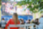 People sit in a summer open-air cinema.jpg