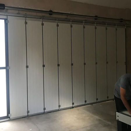 Insulated side sliding garage door.