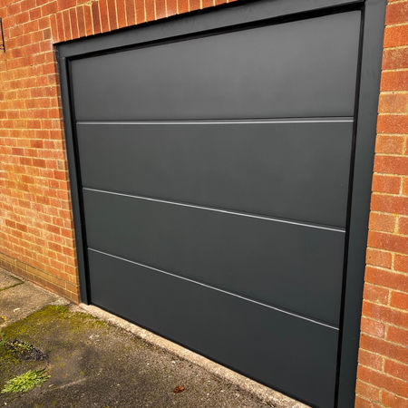 Electric insulated sectional garage door installed in Derby, Derbyshire. 