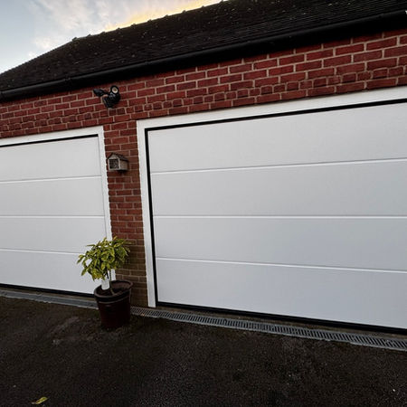 Electric insulated sectional garage door installed in Derby, Derbyshire. 