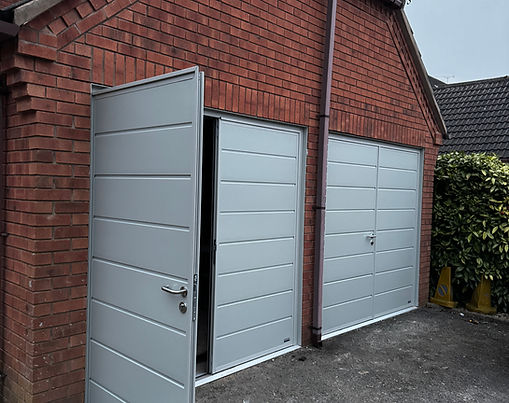 Insulated side hinged garage doors in agate grey installed in Etwall.