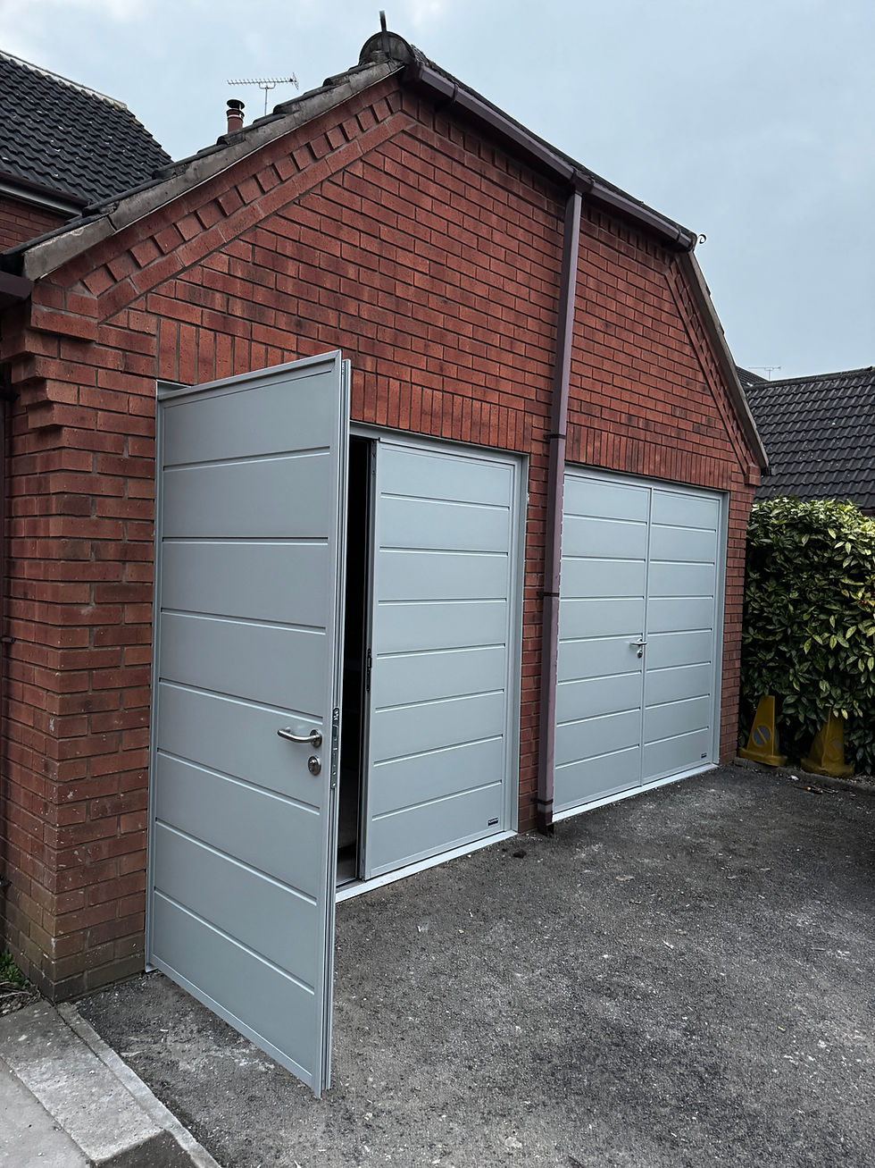 Insulated side hinged garage doors in agate grey installed in Etwall.