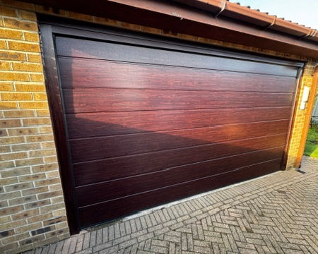 Electric insulated sectional garage door installed in Derby, Derbyshire. 