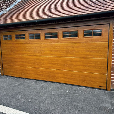 Electric insulated sectional garage door installed in Derby, Derbyshire. 