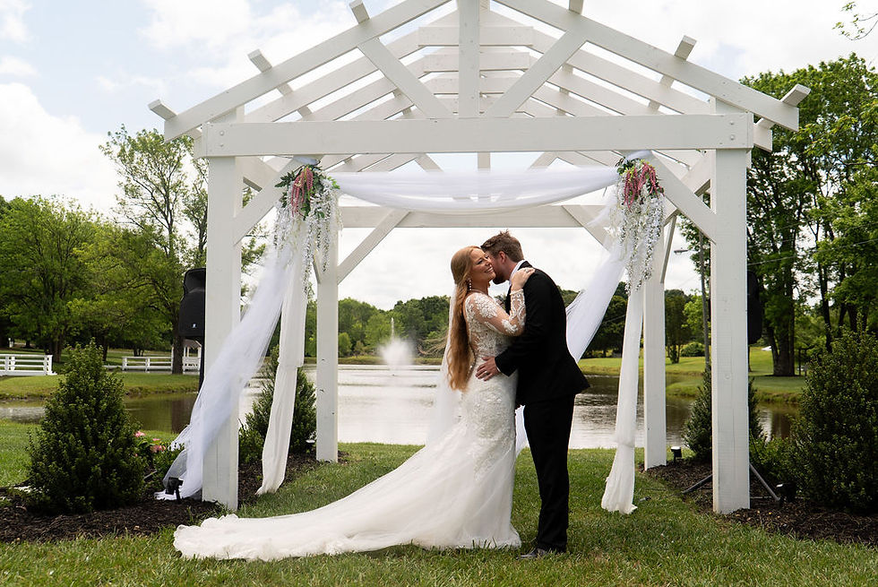 Elegant Countryside Wedding on 15 acres with a pond, pergola, bridge to an island, gazebo, arbor and gate and more.