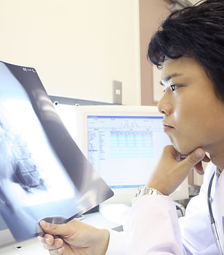 Doctor Examining X-Ray