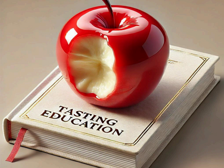 a candied red apple with a bite in it sits on top of a white book