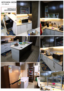 Modern kitchen with white cabinets, dark island, and various appliances shown.